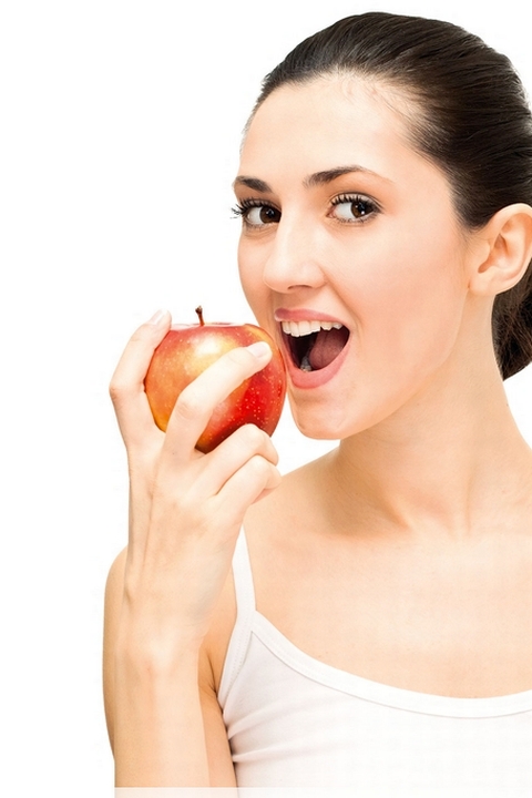 Dental care - an apple a day (woman eating an apple)