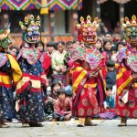Bhutan, 10 things to do in the kingdom of gross national happiness, highlights go bhutan, masked dance at Paro festival