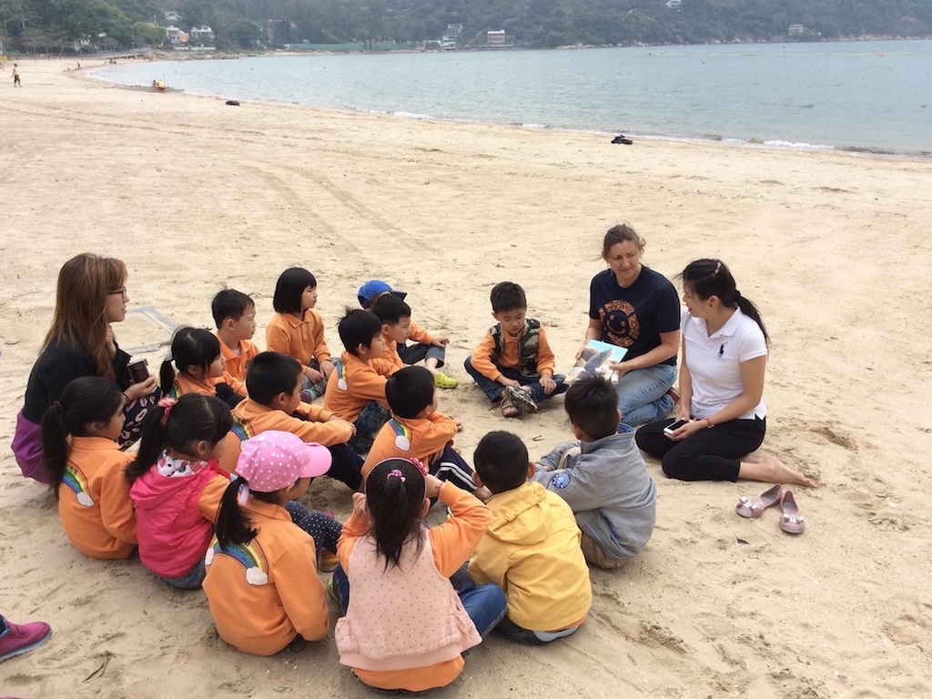 Tracey teaching kids on beach