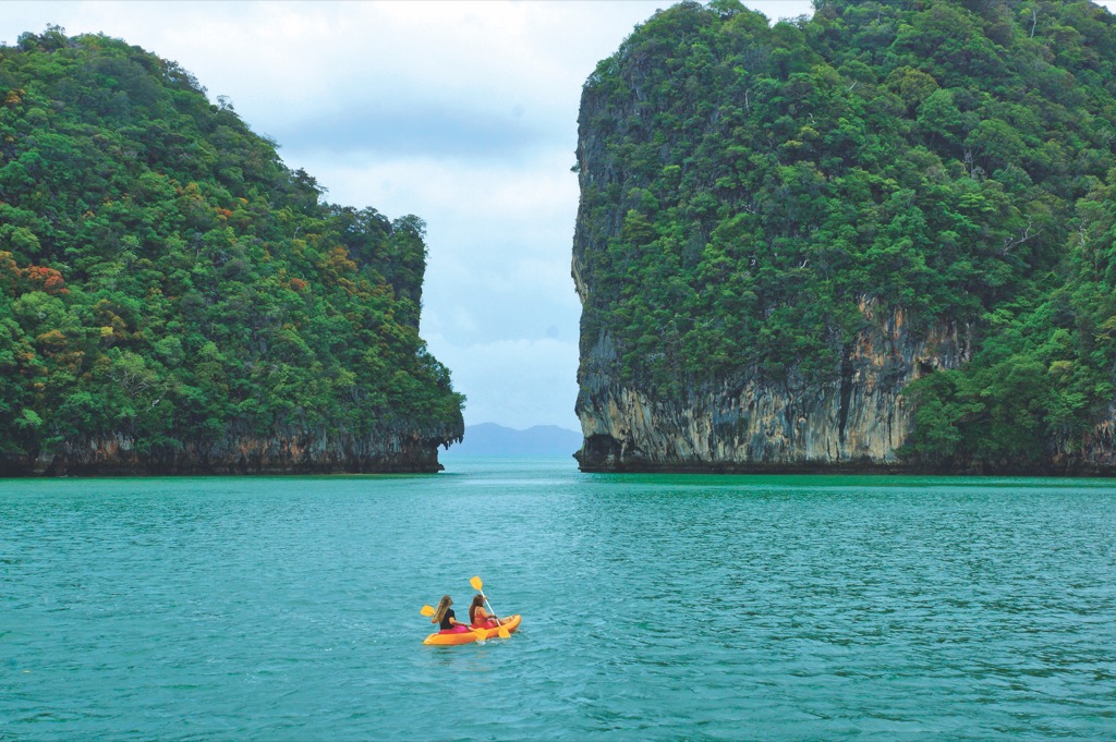 Kayak to uninhabited beaches while cruising off Phuket