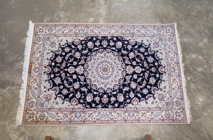 This Fine Persian Nains carpet works well with a cooler colour scheme