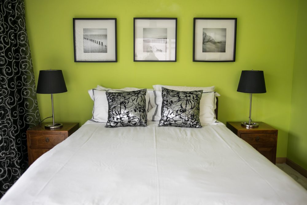 Kaylene's love of colour is evident in the lime green feature wall