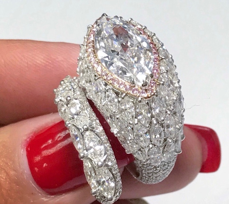 Three carat Marquise cut surrounded by pink diamonds