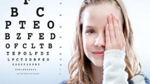 image of girl with bad eyesight doing eye test