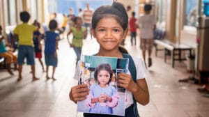 Cambodian Children’s Fund student with picture