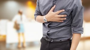 image of man experiencing chest pain