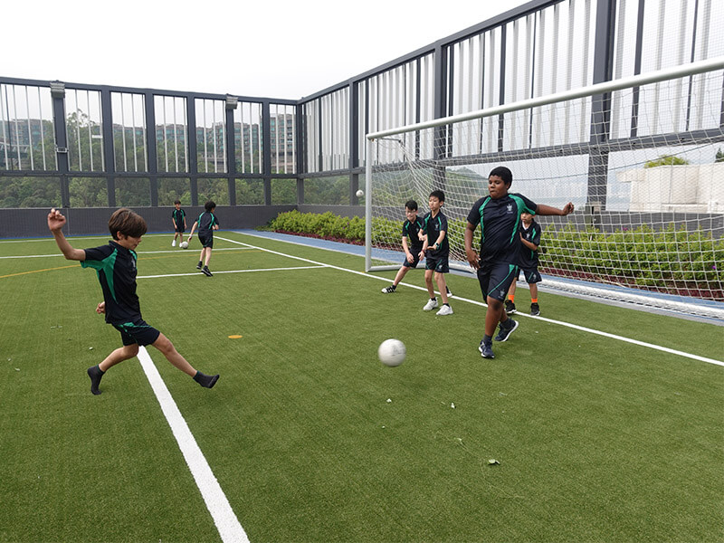 Malvern College students playing soccer