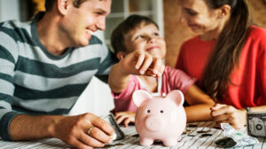 Family with money for web article on how to teach kids about money