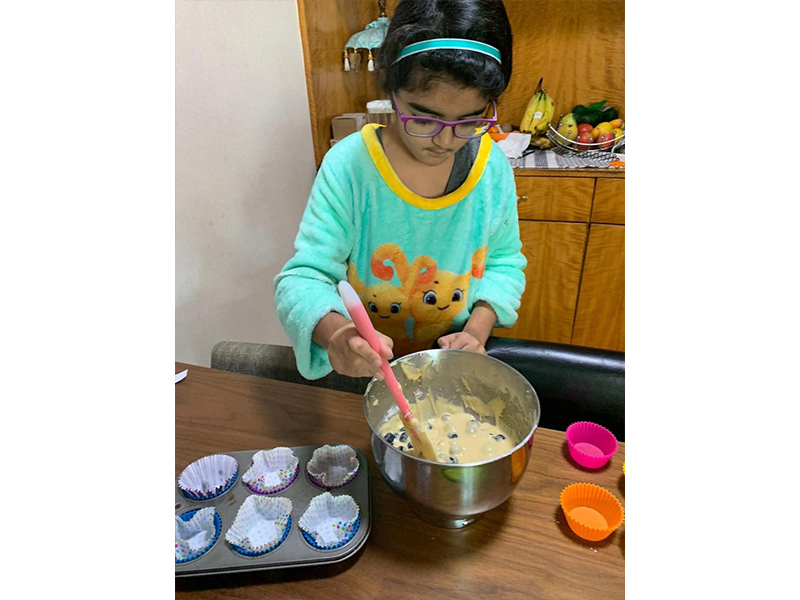 Gia Gera making cupcakes for charity bake sale