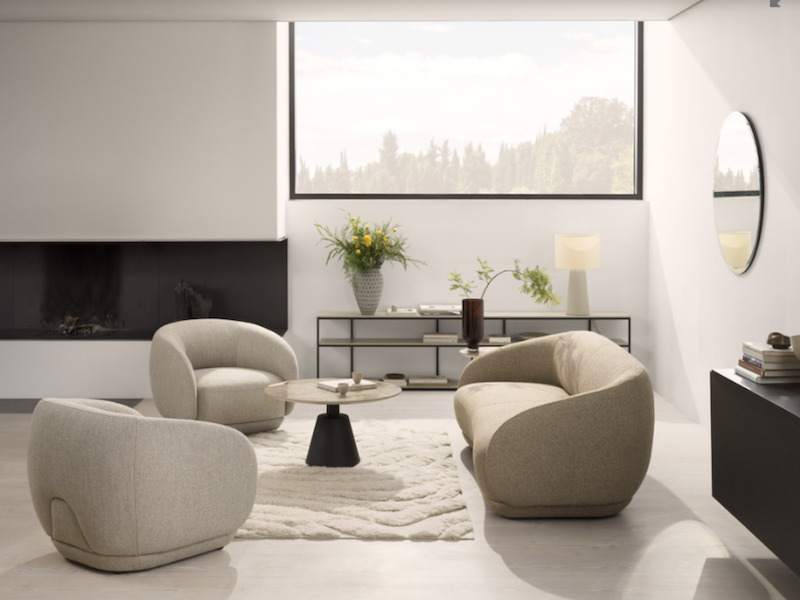 Living rooms - Bolzano three-seater sofa and Bolzano chairs with soft curves and organic forms, available in customised upholstery; Madrid customisable coffee table with brown ceramic tabletop and powder-coated legs, BoConcept